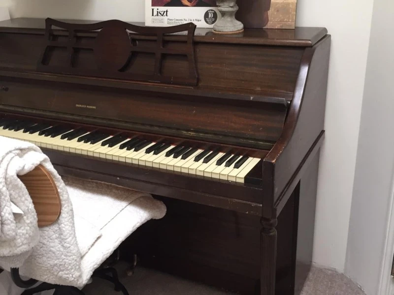 Small vintage wooden upright piano