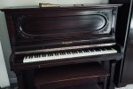 Mendesson upright 54" high, 27" deep, 57" wide piano